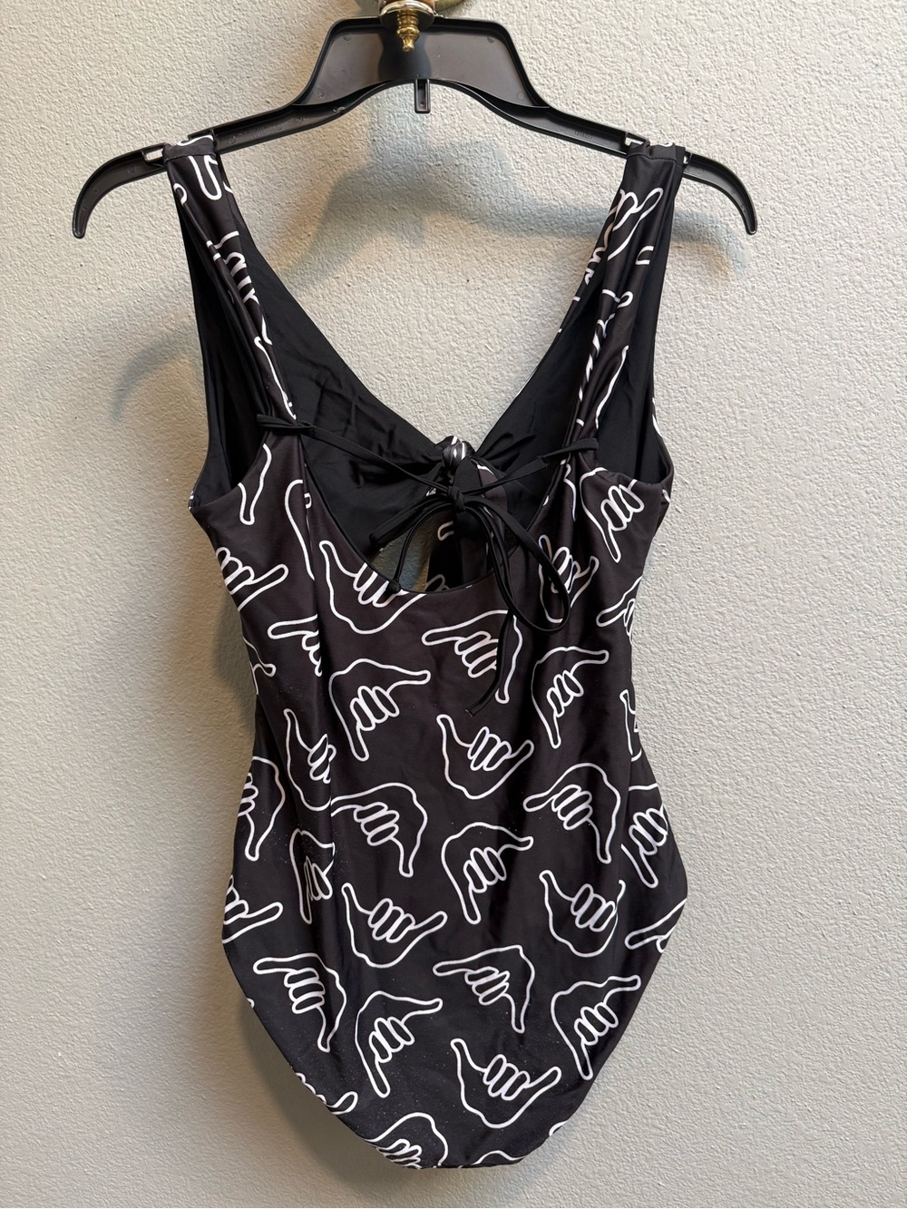 Black One-Piece Swimwear with White Surf Hand Print